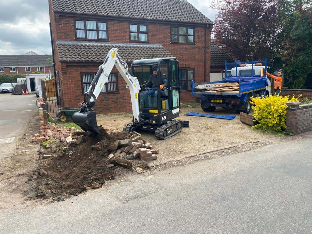 This is a photo of an operative of Watton Driveway Solutions Digging out for a new tarmac driveway